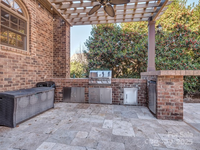 view of patio / terrace featuring an outdoor kitchen, ceiling fan, area for grilling, and a pergola