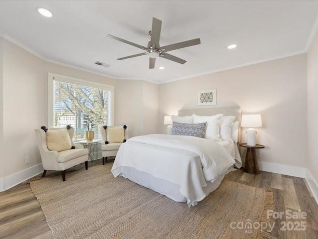 bedroom featuring crown molding, ceiling fan, and light hardwood / wood-style floors