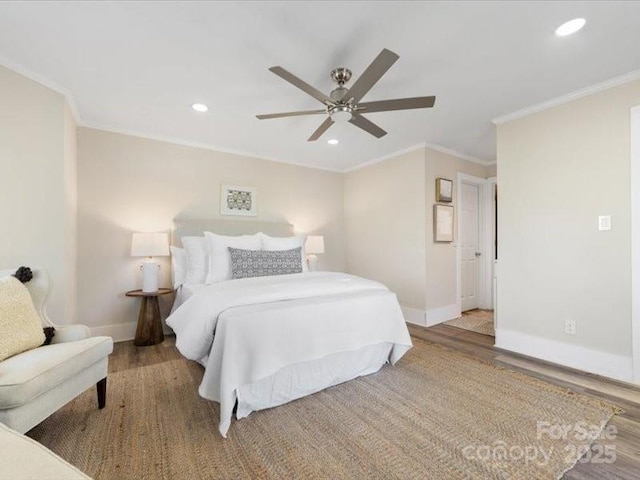 bedroom with hardwood / wood-style flooring, crown molding, and ceiling fan