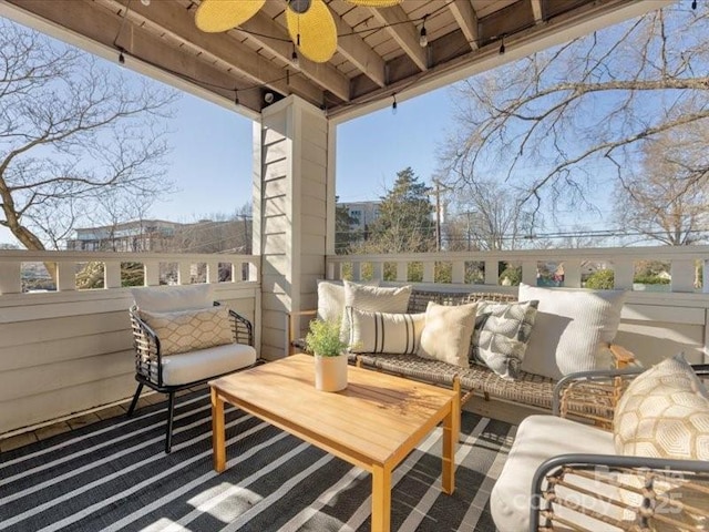 exterior space featuring ceiling fan and an outdoor hangout area