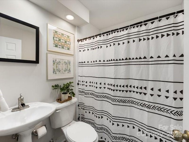 bathroom featuring sink and toilet