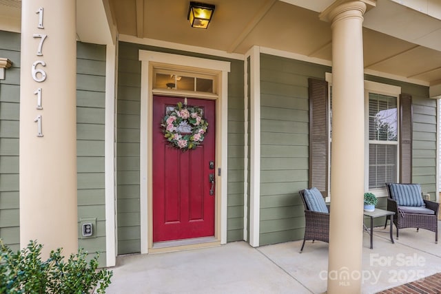 entrance to property featuring a porch