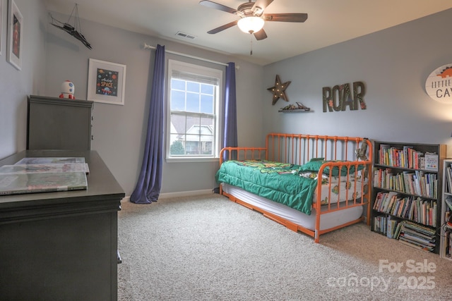 bedroom featuring ceiling fan, carpet, visible vents, and baseboards