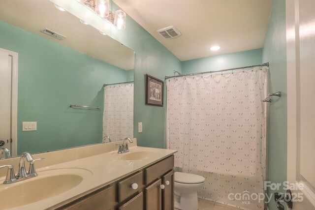 full bath with visible vents, a sink, and toilet