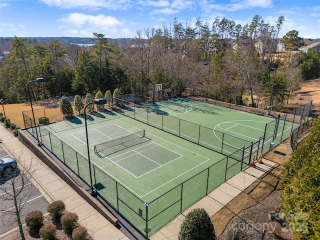 view of sport court featuring community basketball court and fence