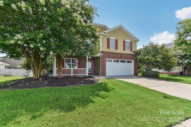 view of front of property featuring a garage and a front lawn