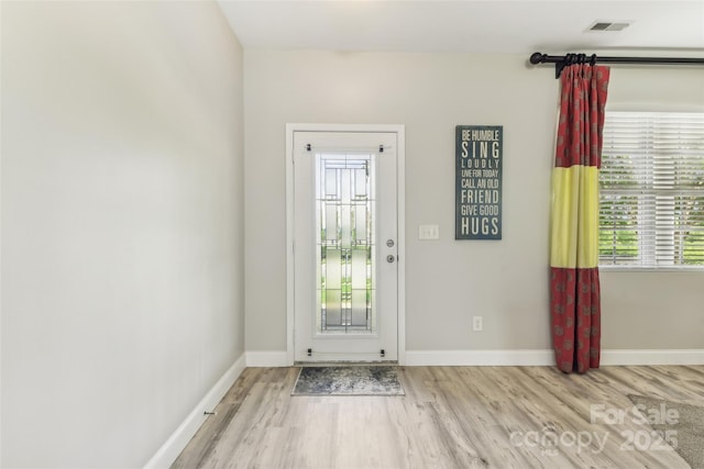 doorway to outside featuring light wood-type flooring