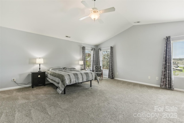 bedroom featuring carpet, ceiling fan, lofted ceiling, and multiple windows