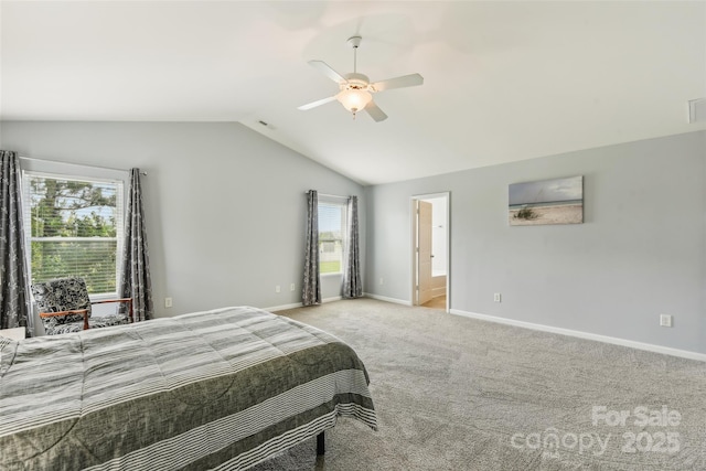 bedroom with carpet floors, ensuite bath, ceiling fan, and lofted ceiling