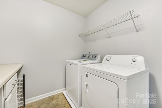 clothes washing area featuring washer and dryer