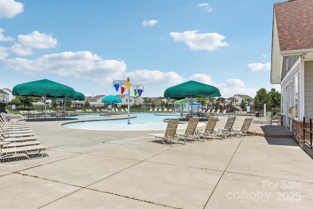 view of swimming pool featuring a patio