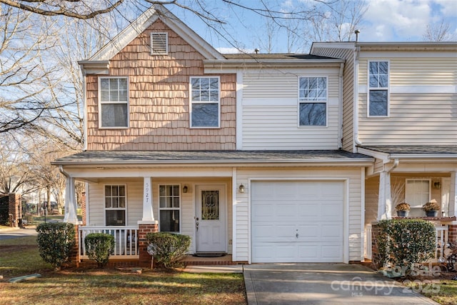 view of front of house with covered porch and a garage