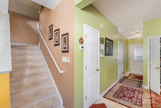 staircase featuring ornamental molding