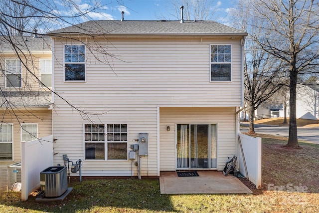 back of house with central air condition unit and a patio