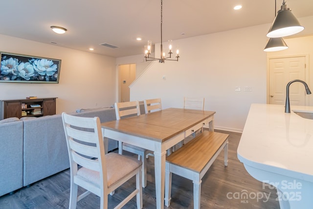 dining room featuring baseboards, dark wood-type flooring, visible vents, and recessed lighting