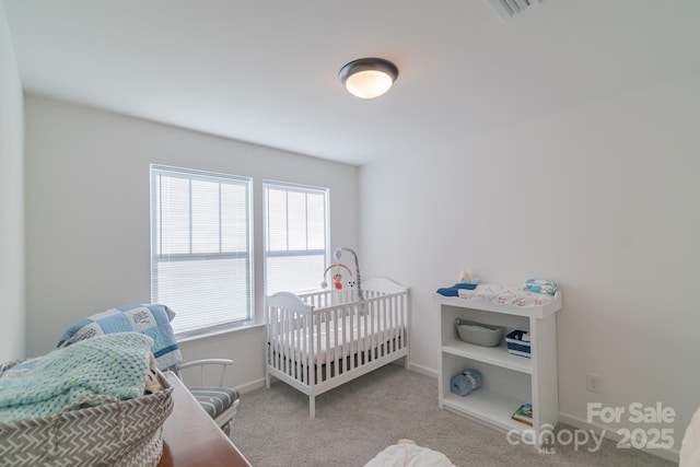 carpeted bedroom featuring baseboards