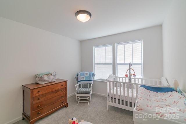 bedroom with baseboards and carpet flooring