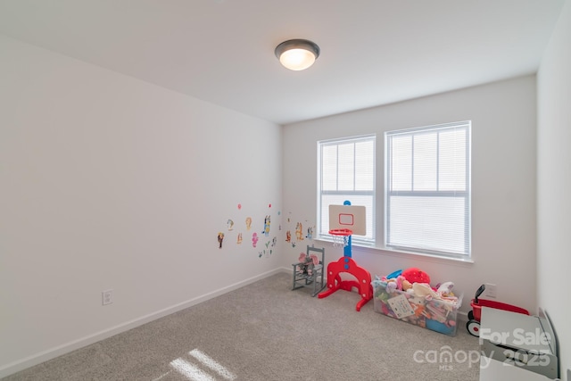 playroom with carpet and baseboards