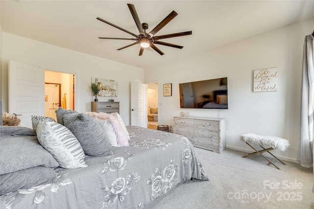 bedroom with ceiling fan, light colored carpet, and connected bathroom