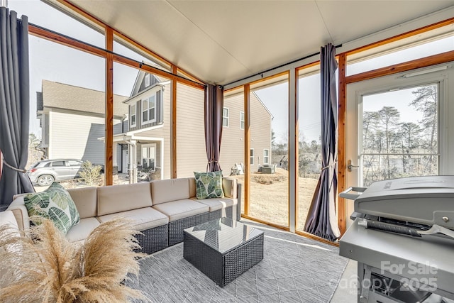 sunroom with vaulted ceiling