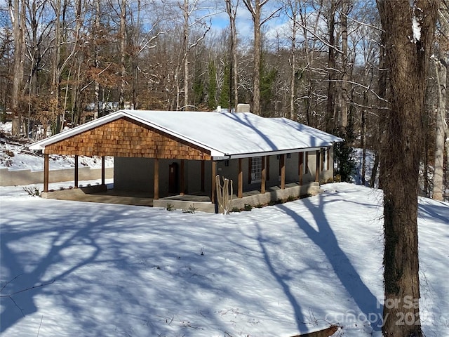 exterior space featuring a porch and a carport