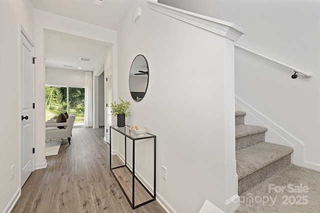 hall with light hardwood / wood-style flooring