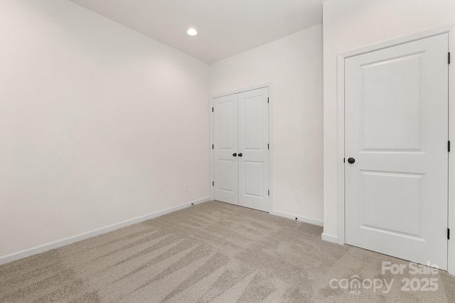 spare room with light carpet