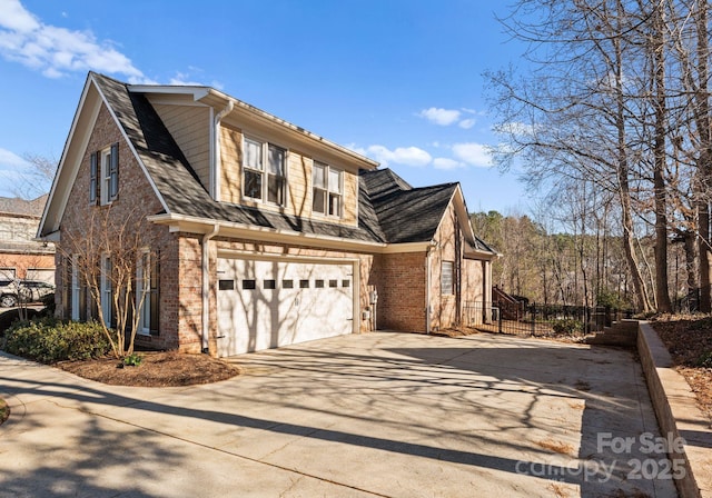 view of side of home featuring a garage