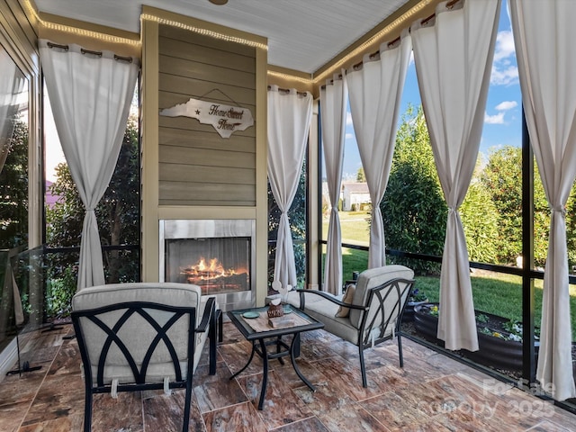 sunroom with exterior fireplace