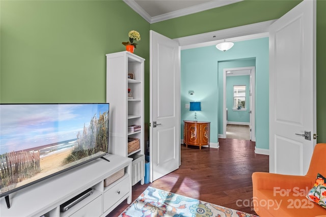 interior space with dark hardwood / wood-style flooring and ornamental molding