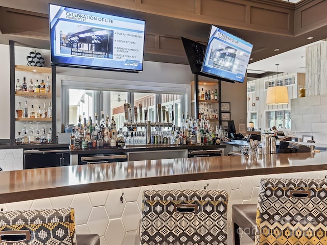 bar with tasteful backsplash and dishwashing machine