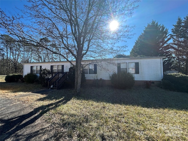 view of front of home with a front lawn