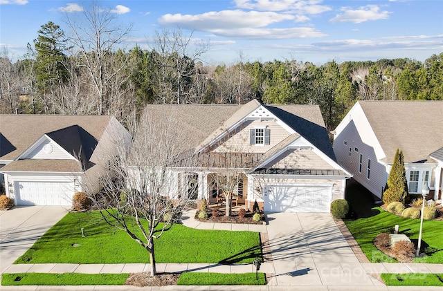 view of front facade with a garage and a front lawn