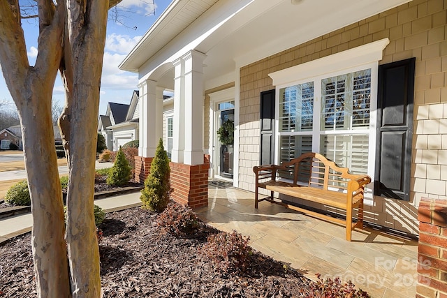 entrance to property featuring covered porch