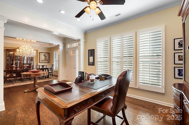 dining room with dark hardwood / wood-style flooring, ornate columns, and crown molding