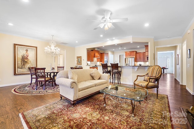 living room featuring ceiling fan with notable chandelier, dark hardwood / wood-style floors, and ornamental molding