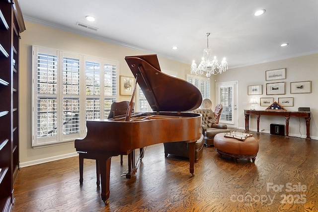 misc room with crown molding, dark hardwood / wood-style floors, and an inviting chandelier