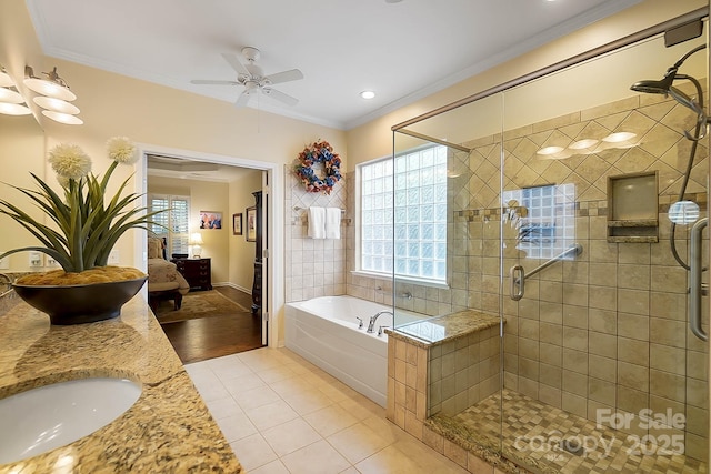 bathroom with tile patterned flooring, ceiling fan, separate shower and tub, and ornamental molding