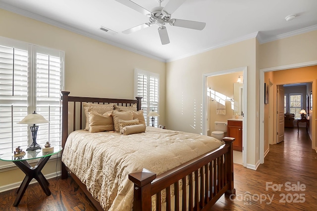 bedroom featuring crown molding, ceiling fan, dark wood-type flooring, and ensuite bathroom