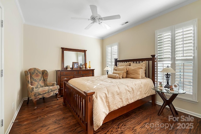 bedroom with ceiling fan, dark hardwood / wood-style floors, and ornamental molding