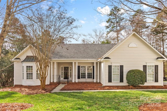 ranch-style home with a front lawn