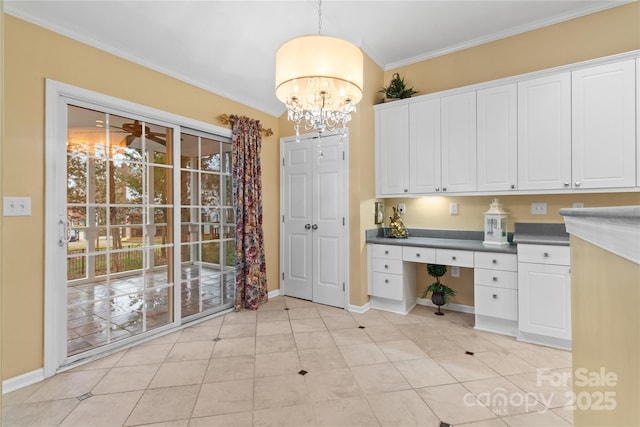 kitchen featuring ceiling fan with notable chandelier, crown molding, decorative light fixtures, white cabinets, and light tile patterned flooring