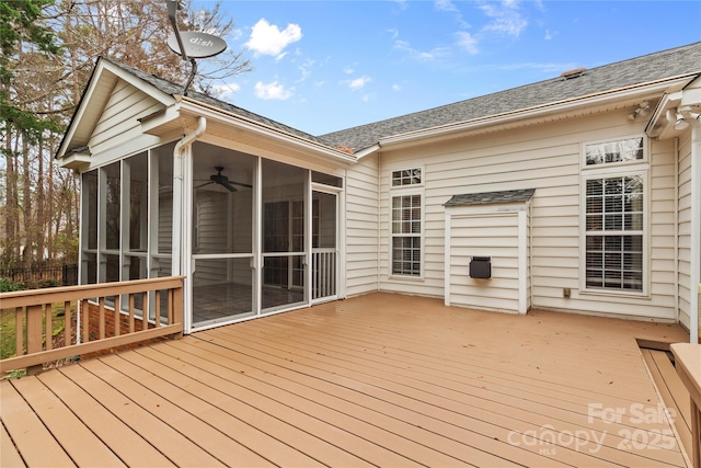 wooden deck featuring a sunroom