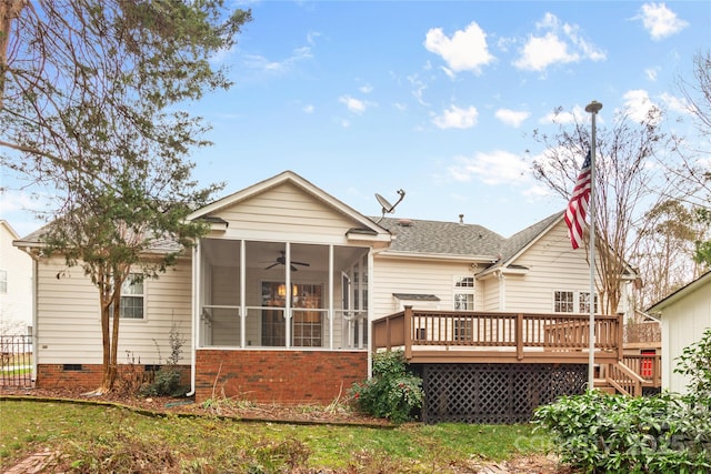 back of house with a sunroom and a wooden deck