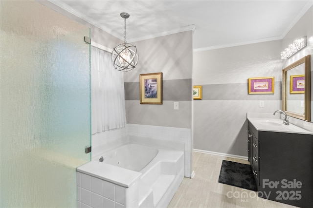 bathroom with vanity, a bathtub, ornamental molding, and a notable chandelier