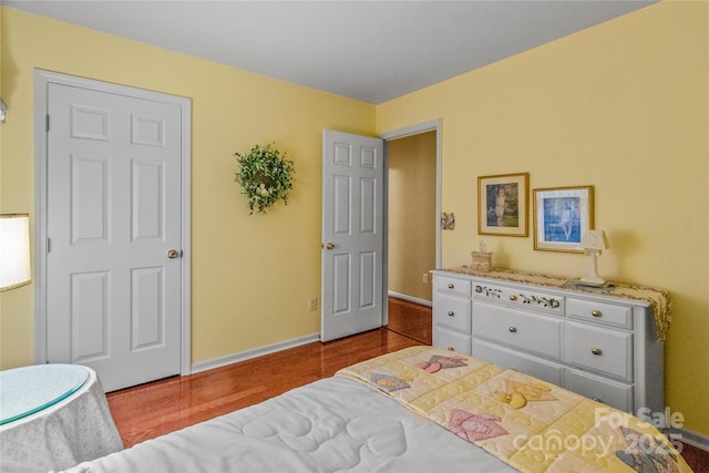 bedroom with hardwood / wood-style flooring