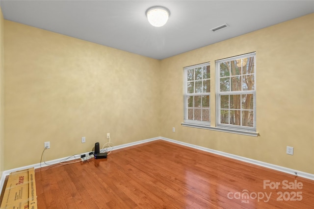 empty room featuring hardwood / wood-style flooring