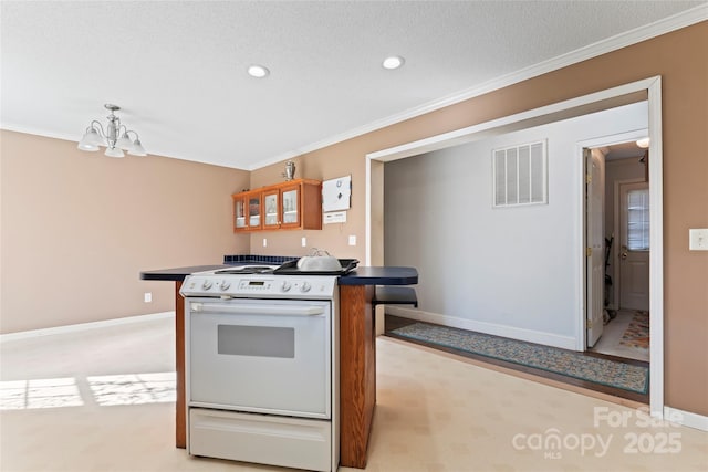 kitchen featuring white electric range oven, a chandelier, and ornamental molding