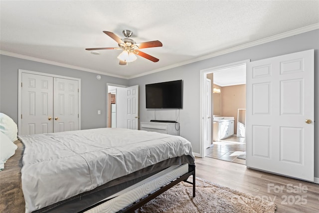 bedroom featuring a textured ceiling, ceiling fan, and crown molding