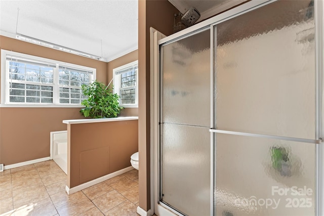 bathroom with tile patterned flooring, ornamental molding, an enclosed shower, and toilet